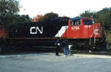 Railfans examining a parked SD75 in Georgetown, Ontario
