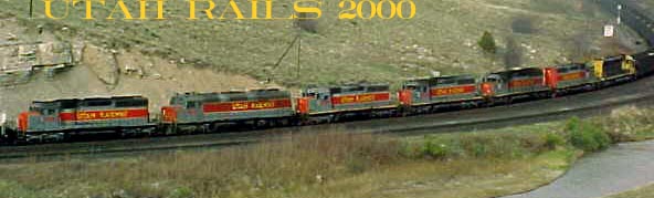 A little help up the hill west of Helper, UT with 3 big AC's on the point and 7 helper engines in the middle. SD40, F45, SD40, SD40, SD40, SD40 and an ex ATSF SD45. May 2000.