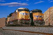 UP 4868 swaps crew with UP 5774 at the west switch of Garnet siding. This is approx. 20 miles north of Las Vegas, NV. (229K)