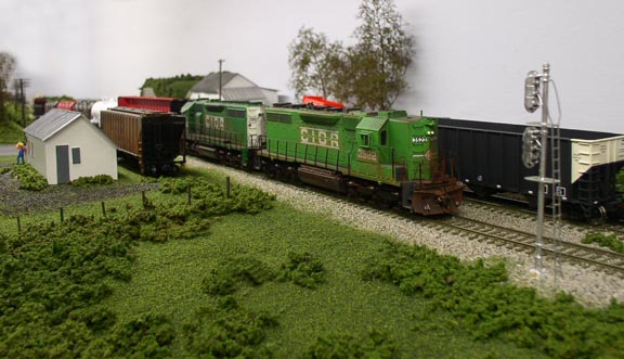 CIOR SD35 #3522 leads train X46 westbound at Henry Road crossing.