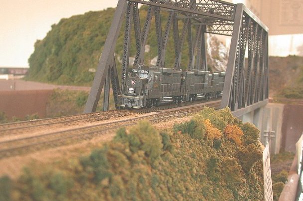 a run through set of PRR GP30s pull a coal drag across the bridge at Towners