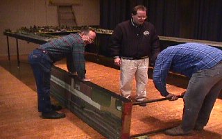 Installing the legs on a middle section. 51K