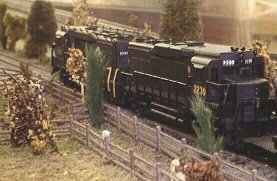 A pair of Pennsylvania GP30s leads a train on the branch line. 23K