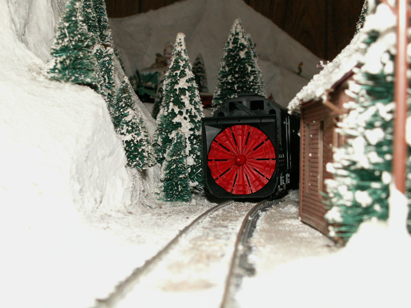 A rotary snowplow on the track behind the Lone Wolf Cafe