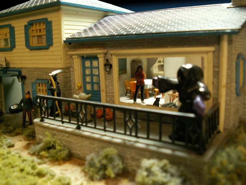 A father escorts his kids as they trick or treat