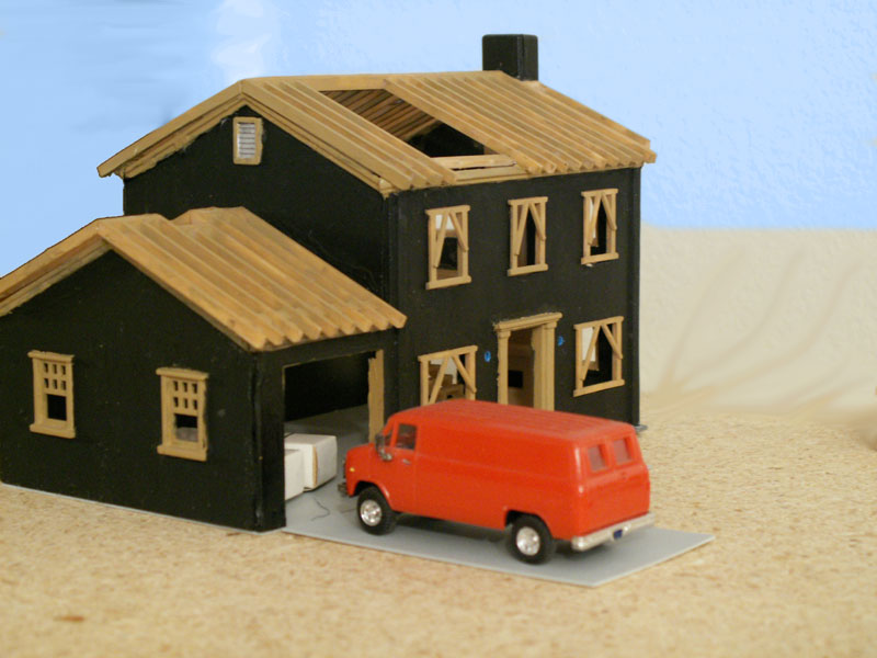 electrician's van in driveway of  house under contruction