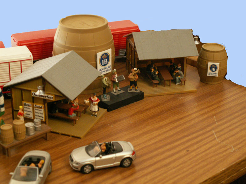 The band is on stage while the beer maid serves the beer