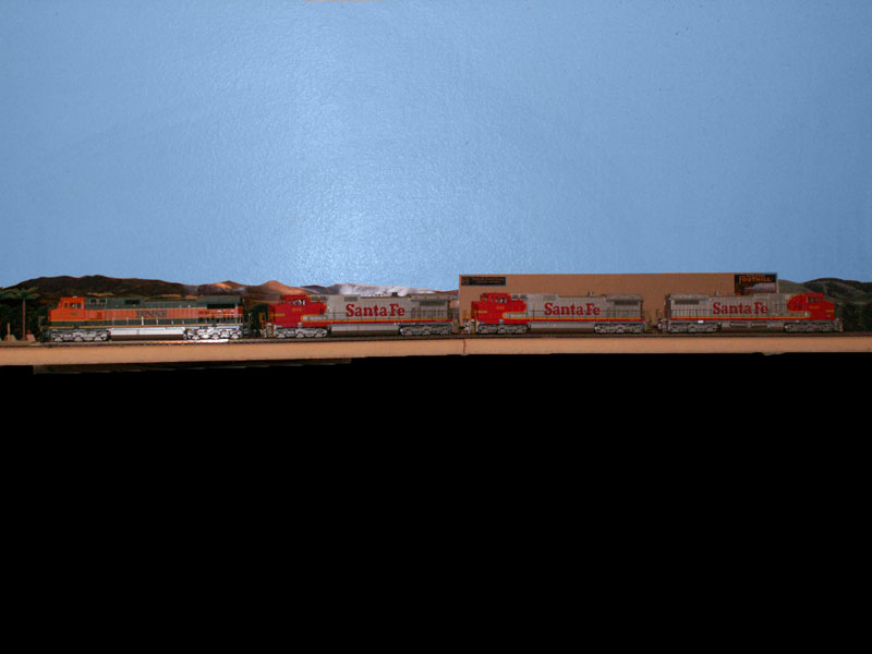 A group of Santa Fe C44-9w is lead by a Burlington Northern Santa Fe locomotive