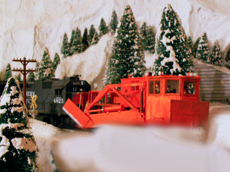 A custom build Jordan Spreader clears snow from the mainline near the summit