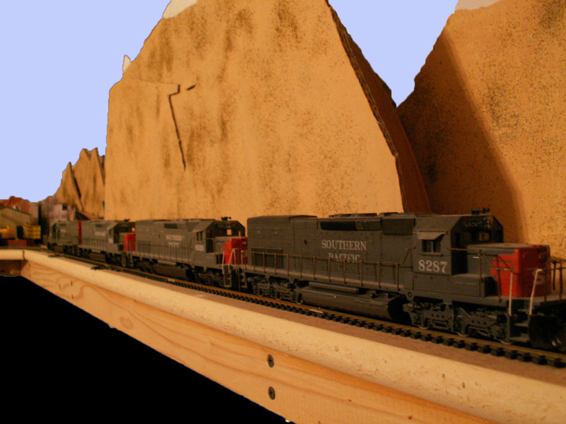 A quartet of Southern Pacific tunnel motors waits under the arrowhead.