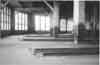 Steam, air and electric lines all ran down columns.  Dual grindstone machine against window