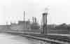 Shop tracks. Tower with water hose to sprinkle coal in tender of outbound engine for dust control