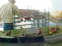 The RASG club's American Models 4-8-4 Northern locomotive is passing the A. C. Gilbert construction site made of Erector Set parts.