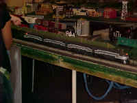 This beautiful set of New York Central locomotives pulls a long consist of heavy weight passenger cars.