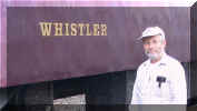 Bill Weed next to a Royal Hudson passenger car.