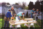 Busy members begin the structure planning.