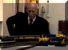 A visitor examines the layout.