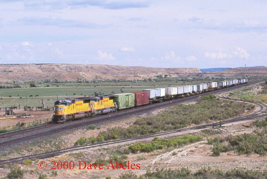 UP train ZDVRO (Denver, CO to Roper [Salt Lake City], UT Priority UPS Intermodal) eastbound at East Wellington, UT 08/18/00